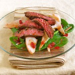 Winter Spinach Salad with Roasted Pears, Flank Steak and Dried Cranberry Vinaigr