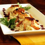 Scallops with mushroom risotto and blackberry sauce