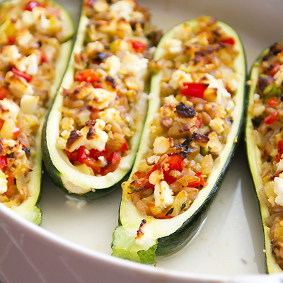 Zucchini stuffed with farro, red pepper and feta