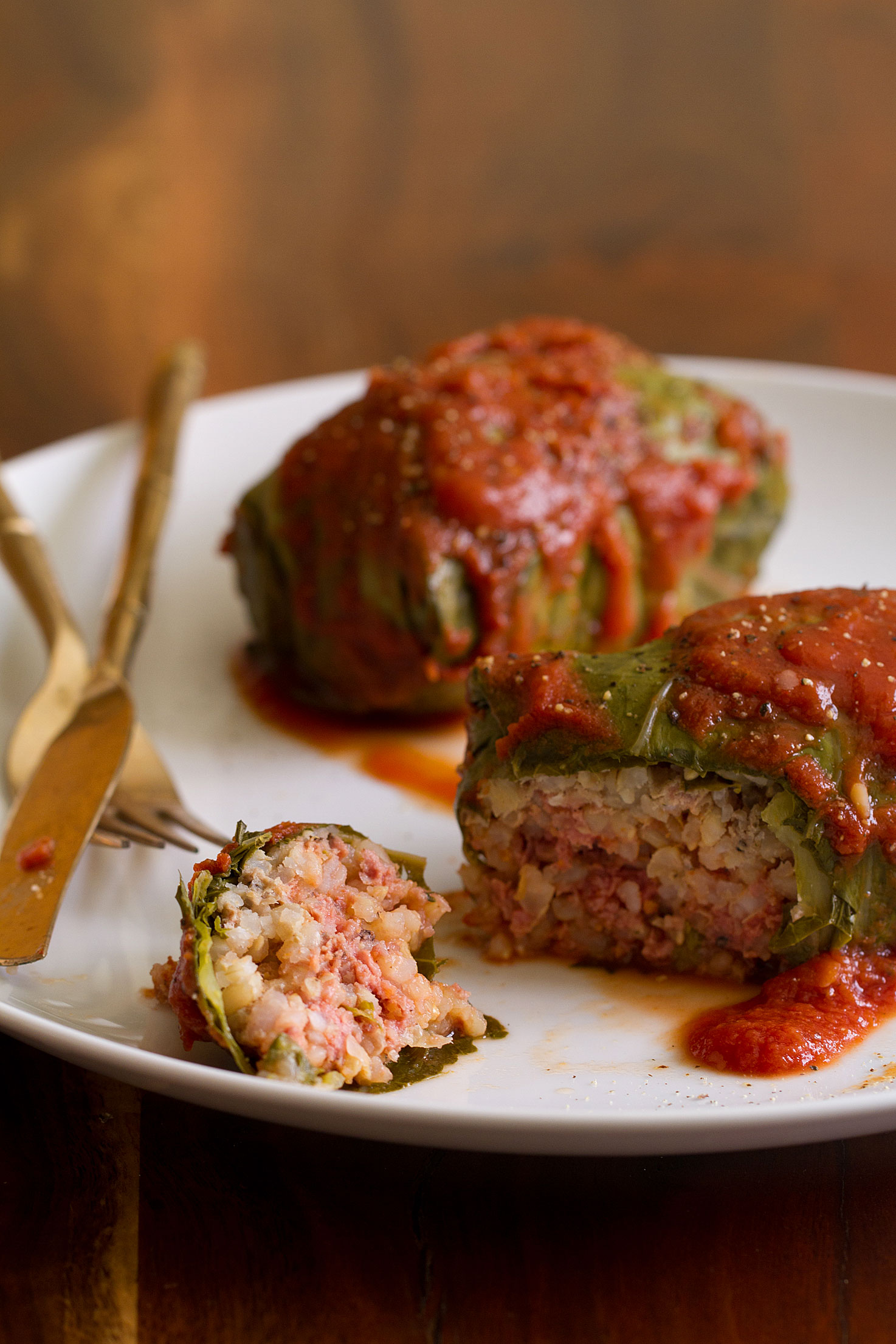 Pork-Stuffed Collards with Tomato Sauce