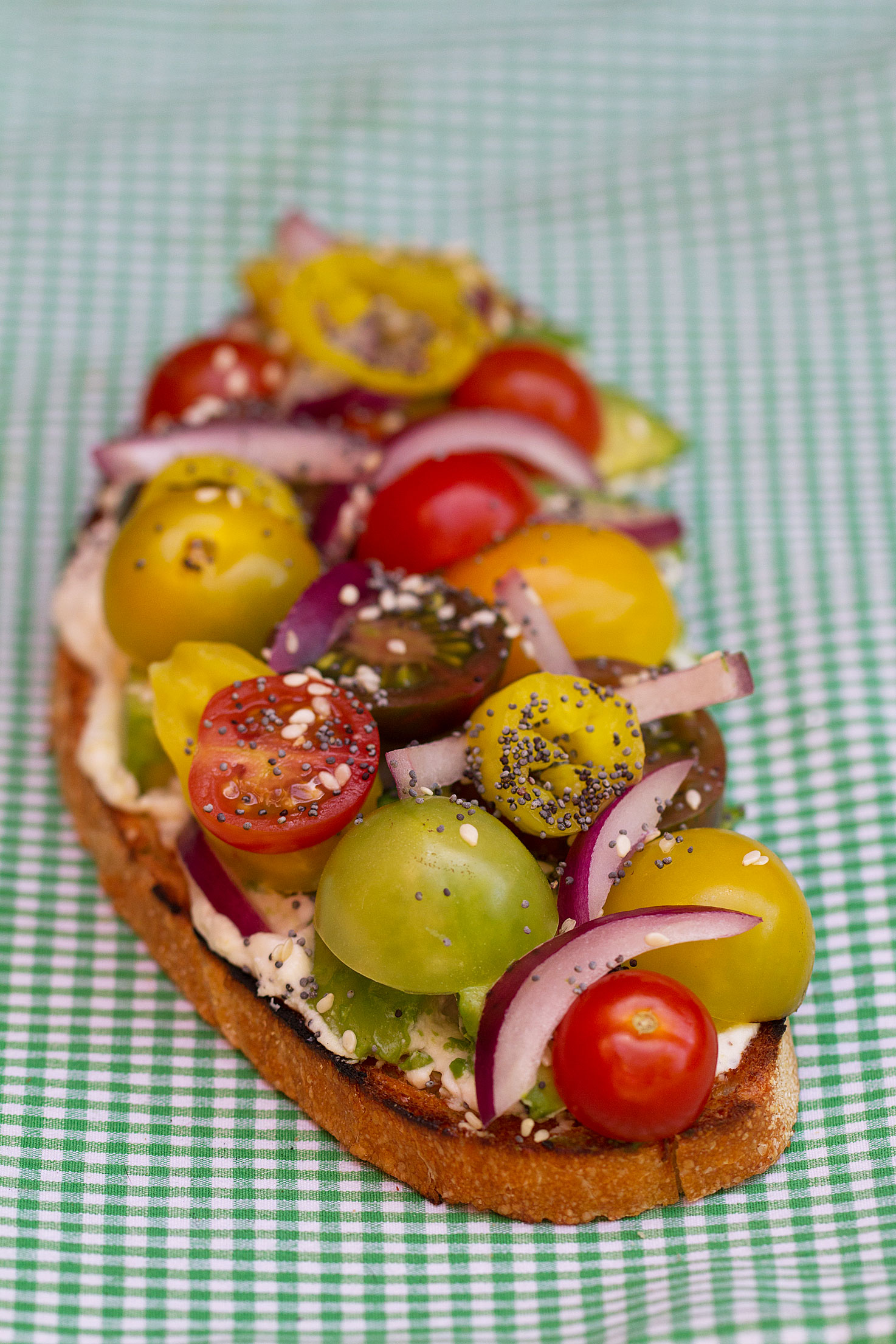Open-Faced Avocado Sandwich with Lemon Ricotta, Tomatoes, and Pickled Peppers