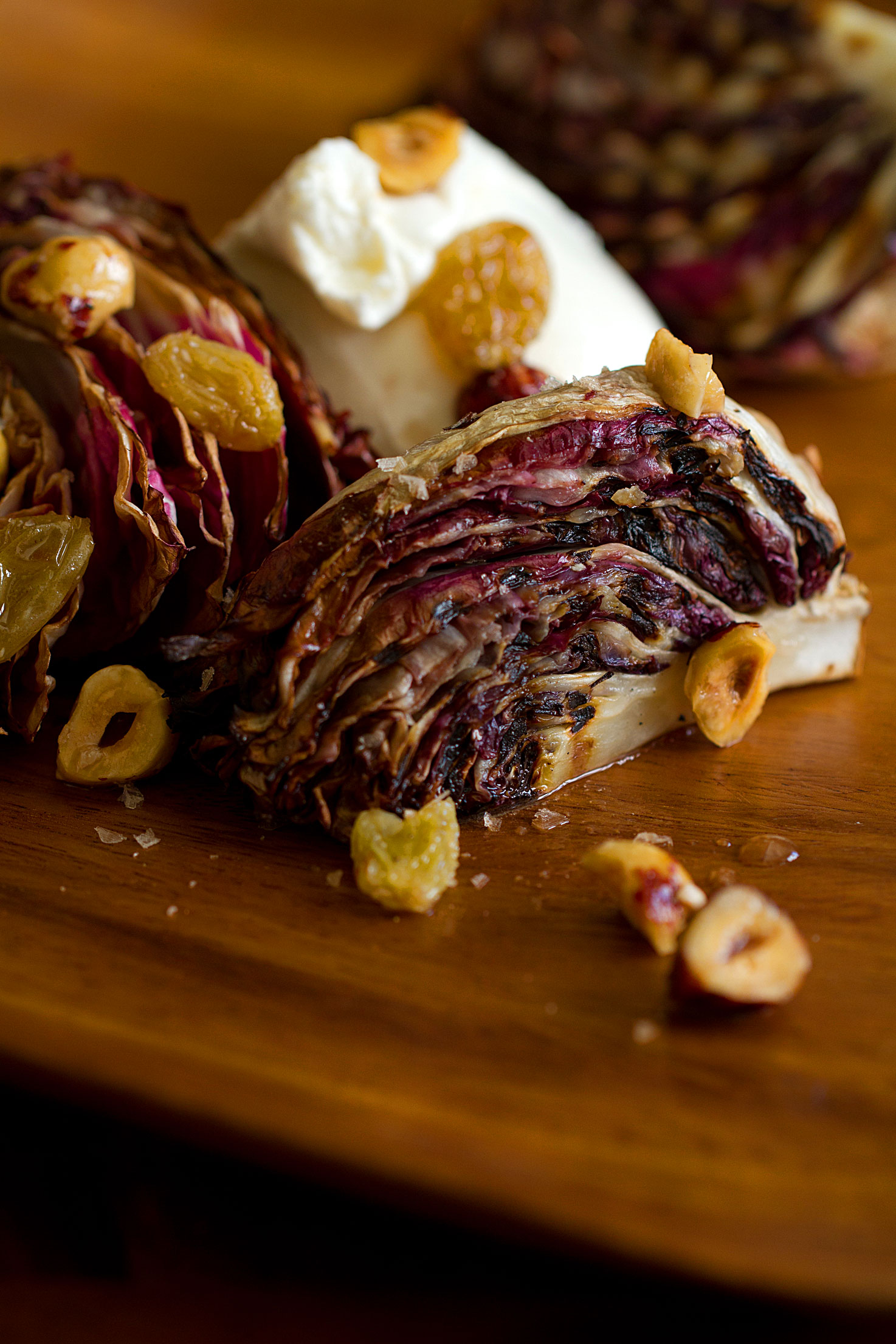 Grilled Radicchio with Burrata, Golden Raisins, and Hazelnuts