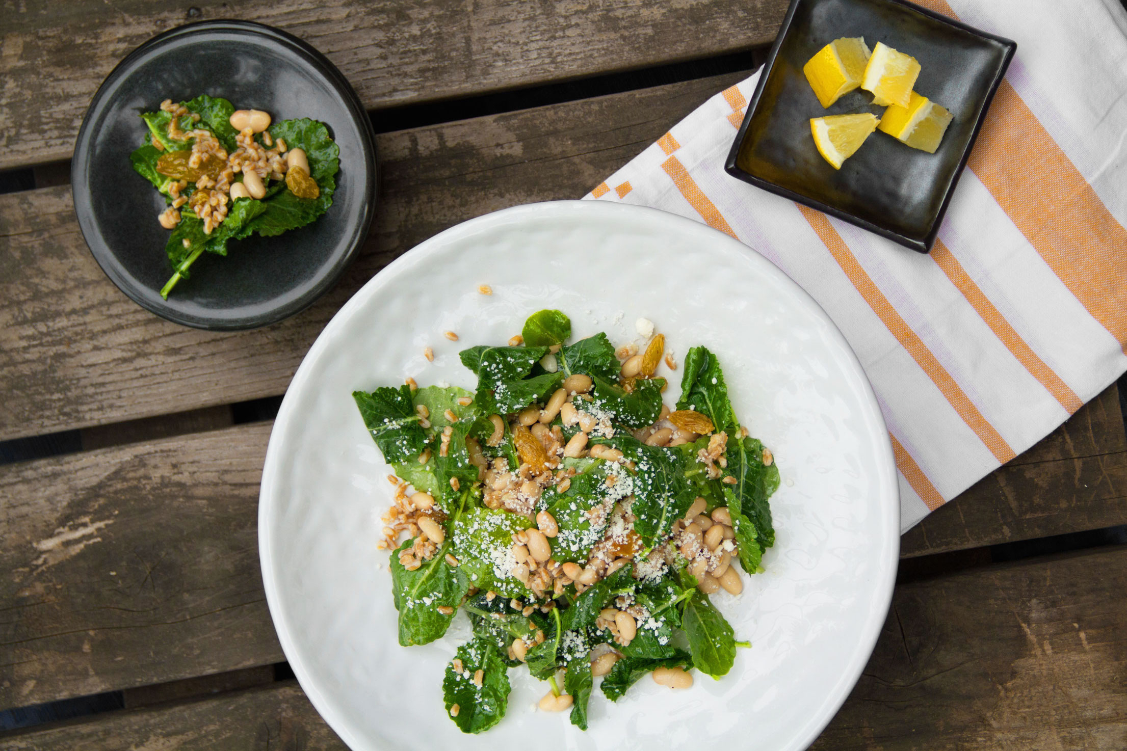 Baby Kale Salad with White Beans, Farro, and Golden Raisins