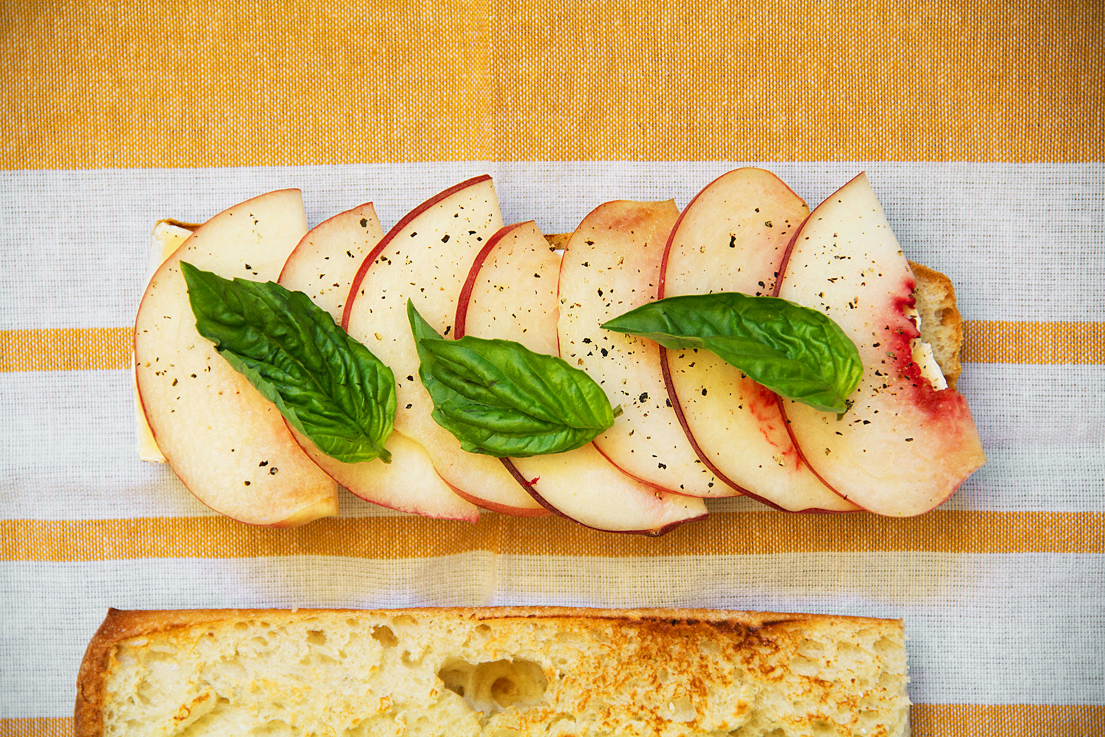 Peach and Camembert Baguette with Basil and Black Pepper.