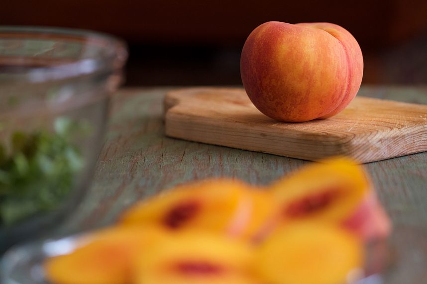 Ripe peach on cutting board