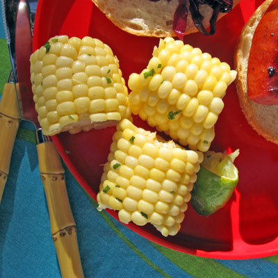 corn on the cobb with herb butter and lime