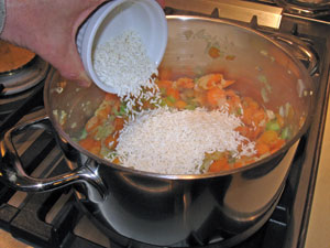 adding rice to the mirepoix