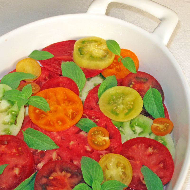 sliced tomatoes with basil