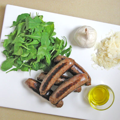 ingredients for grilled sausages and arugula pesto